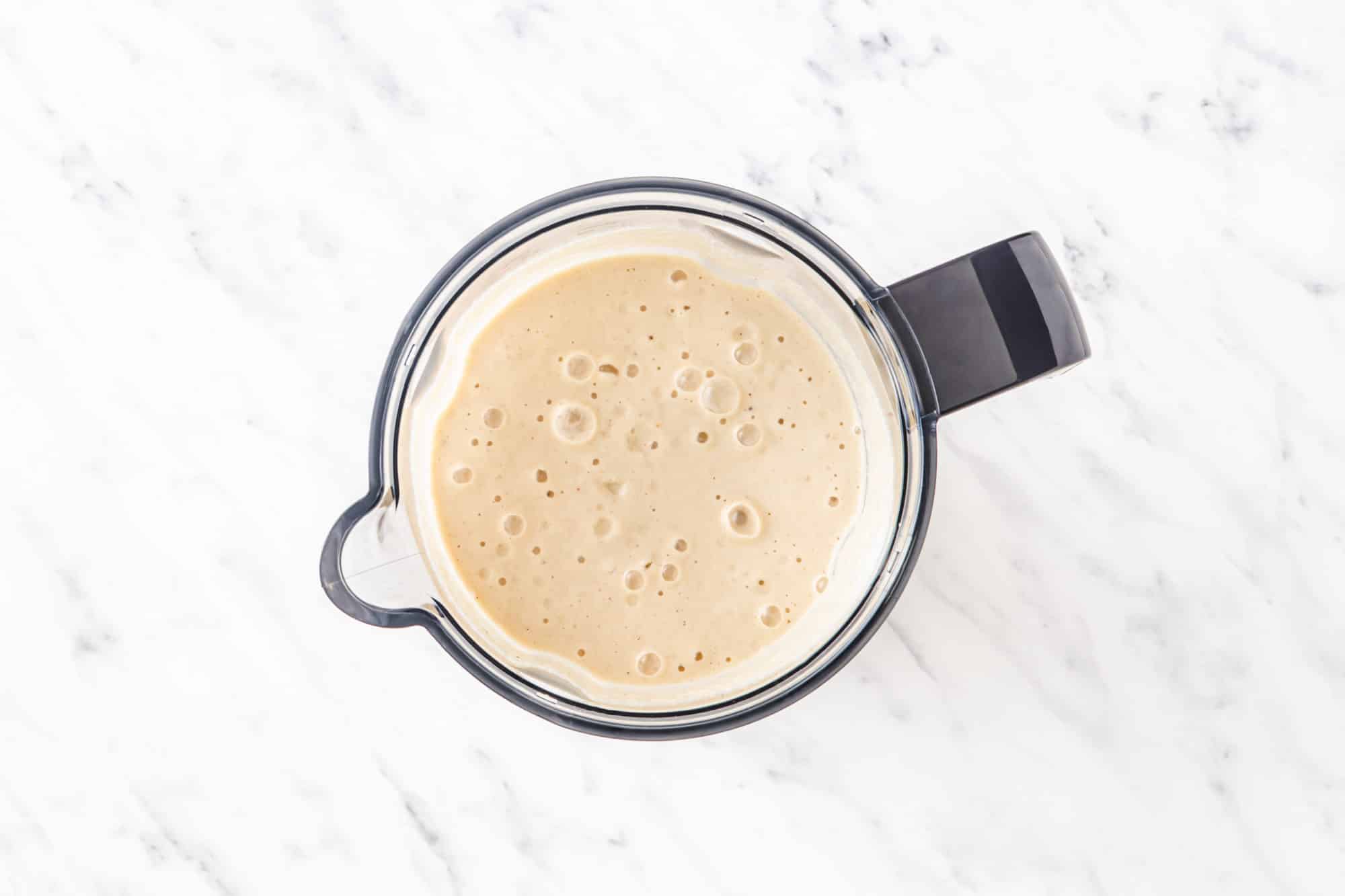 blended apple smoothie in a blender.