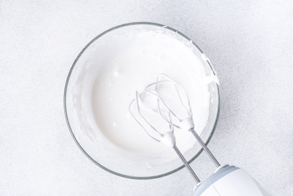 icing for easter bread in a clear bowl.