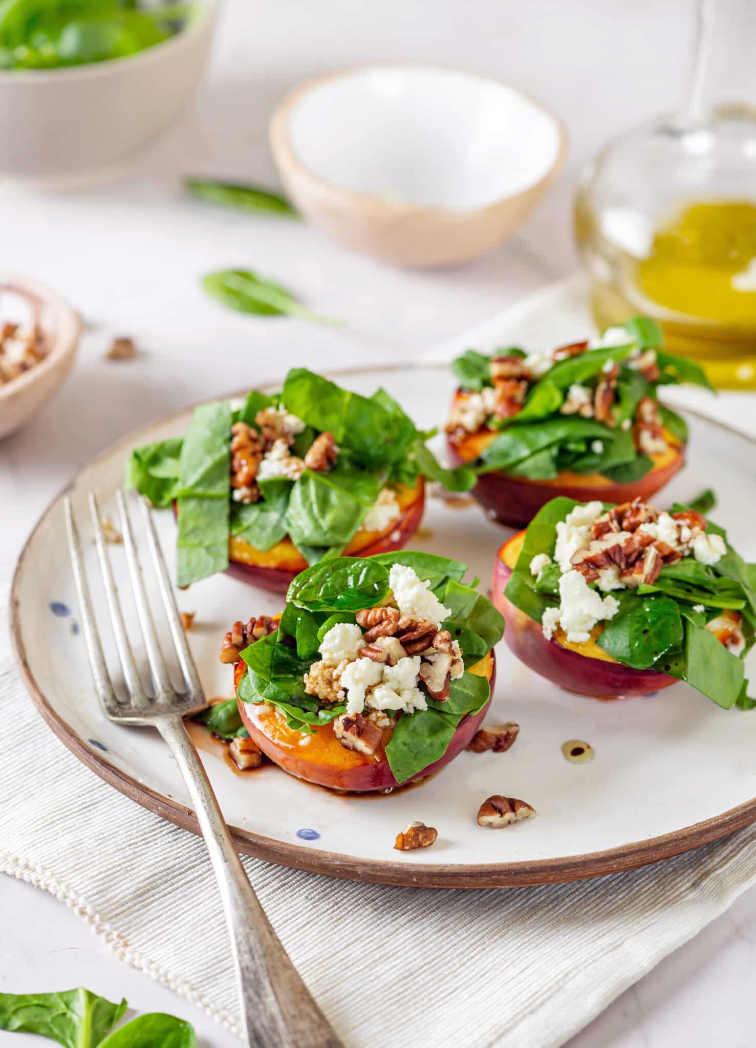 nectarine-salad-on-a-white-plate-with-a-fork-on-a-towel