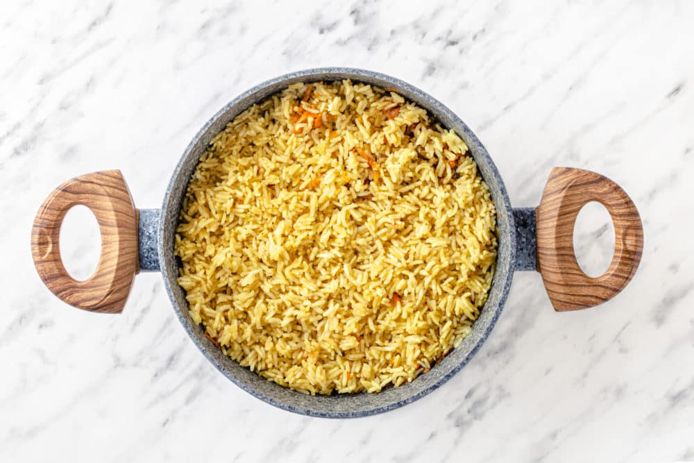 a pot with cooked rice in it.