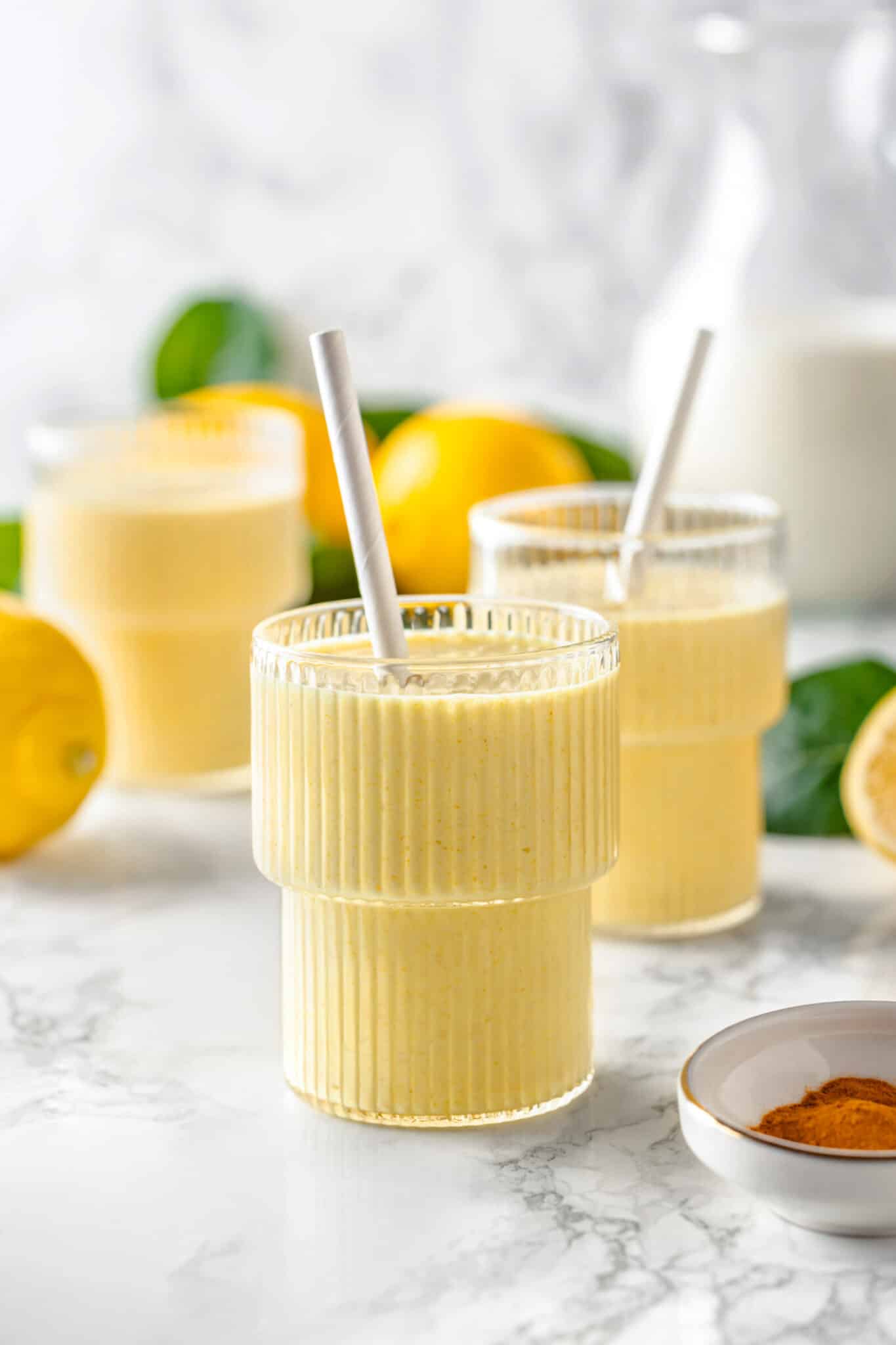 ready lemon smoothie in three glasses.
