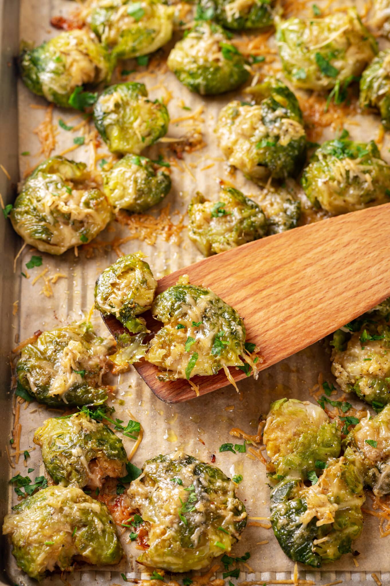 Close up of baked brussels sprouts on a baking dish.
