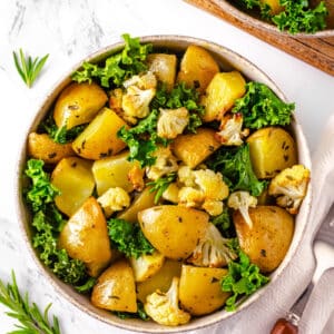 roasted potatoes with fresh kale and cauliflower.